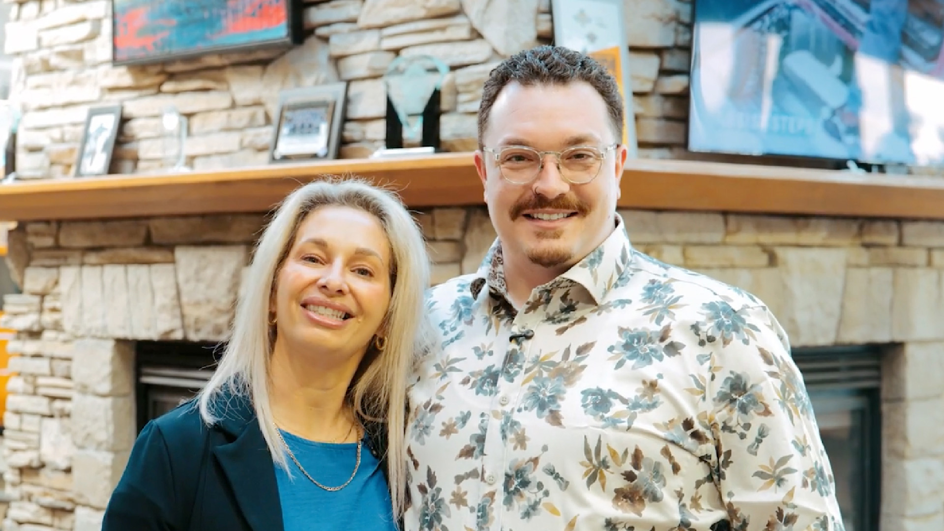 2026_WBAF_WebsitePhotos-03 Pictured is two Wood Buffalo Auto Financing managers in bright interior home ready to help customers get auto loans for vehicles in Fort McMurray